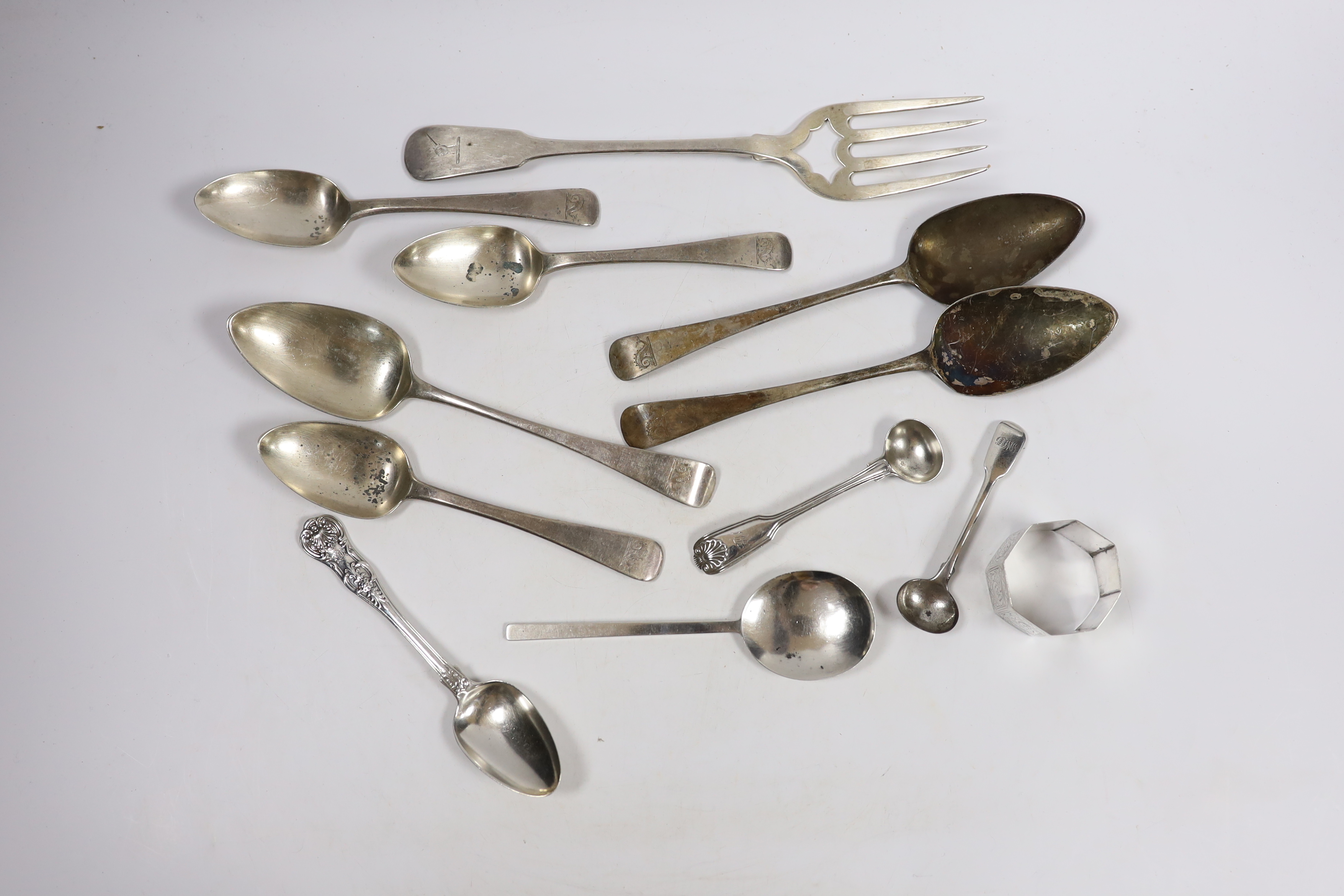 Eleven assorted items of mainly 19th century silver flatware and a silver napkin ring, 18oz.